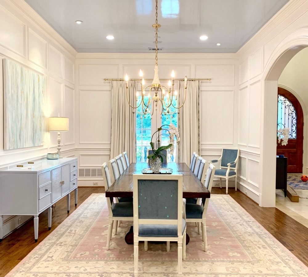 Formal dining room with wainscoting and a glossy lacquered ceiling installed by Joe James